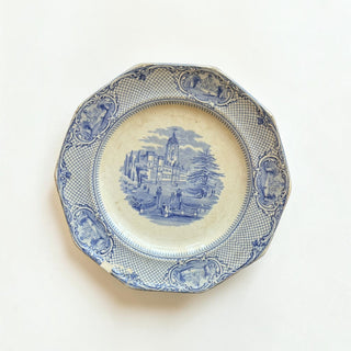 Her Good Eye vintage blue and white transferware ceramic plate with scalloped edges and detailed estate scene.