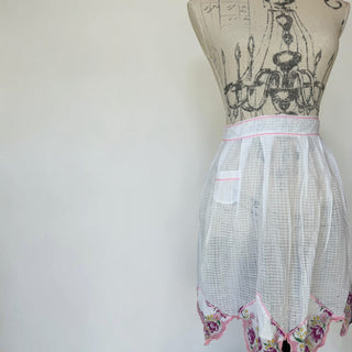 Her Good Eye vintage sheer white checkered half apron with floral embroidered handkerchief hem and pink ric-rac trim.