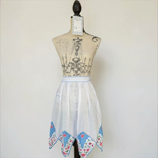 Her Good Eye vintage white gingham half apron with floral trim and side pocket. Lightweight cotton.