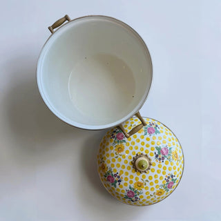 Her Good Eye vintage yellow polka dot enamel stock pot with floral bouquet lid and brass handles.