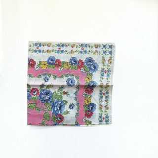 Her Good Eye vintage cotton handkerchief with blue roses, red and yellow flowers on a pink and white floral border.