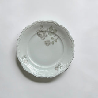 Her Good Eye vintage porcelain dinner plate with grey rose floral motif and elegant scalloped edges on white background