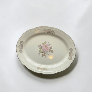 Her Good Eye vintage oval porcelain serving platter with a pink rose floral motif and gold filigree scalloped edges.