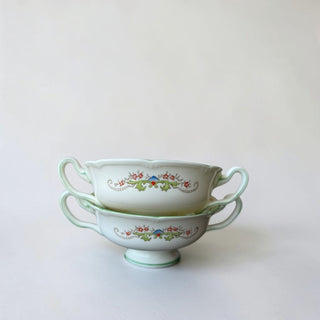 Her Good Eye vintage porcelain soup bowls with handles, featuring a floral pattern and green trim.