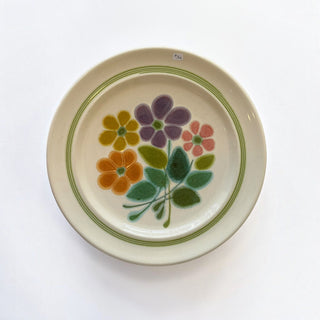 Her Good Eye vintage stoneware salad plate with hand-painted floral motif in mustard, purple, coral, and sage green.