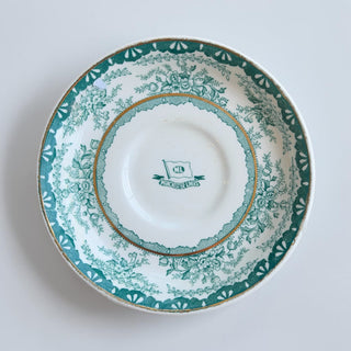 Her Good Eye vintage teal porcelain saucer with floral pattern and gold rim, featuring ML Manchester Liners insignia.