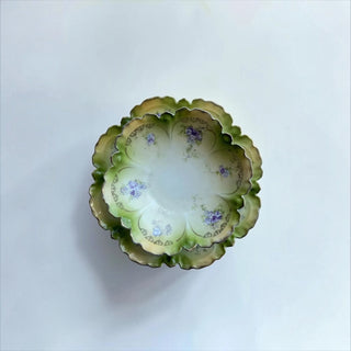 Her Good Eye vintage porcelain serving bowls with scalloped edges, green wash, and violet floral motifs.