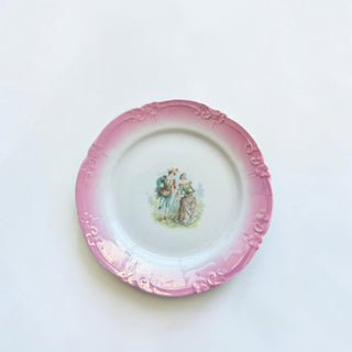 Her Good Eye vintage porcelain plate with a pink scalloped rim and a hand-painted 18th-century couple scene.