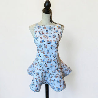 Her Good Eye vintage-inspired light blue quilted kitchen apron with a playful novelty print of children playing.