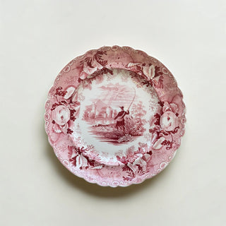 Her Good Eye vintage ceramic dinner plate with a crimson red pastoral fisherman scene and ornate scalloped edges.