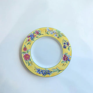 Her Good Eye yellow ceramic dinner plate with a decorative floral border featuring hand-painted roses, bluebells, and berries.
