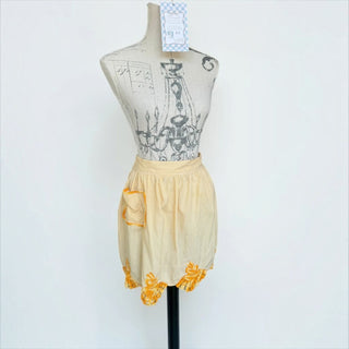 Her Good Eye vintage style yellow gingham waist apron with a side pocket and bright orange crochet hem detail.