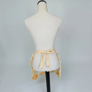 Her Good Eye vintage style yellow gingham waist apron with orange crochet trim tied on a mannequin